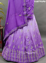A traditional style purple lehenga with white bead work