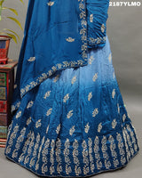 A blue traditional style silk lehenga with white bead work
