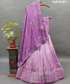 A traditional style Upada silk lehenga in purple with white bead work 