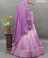 A traditional style Upada silk lehenga in purple with white bead work 