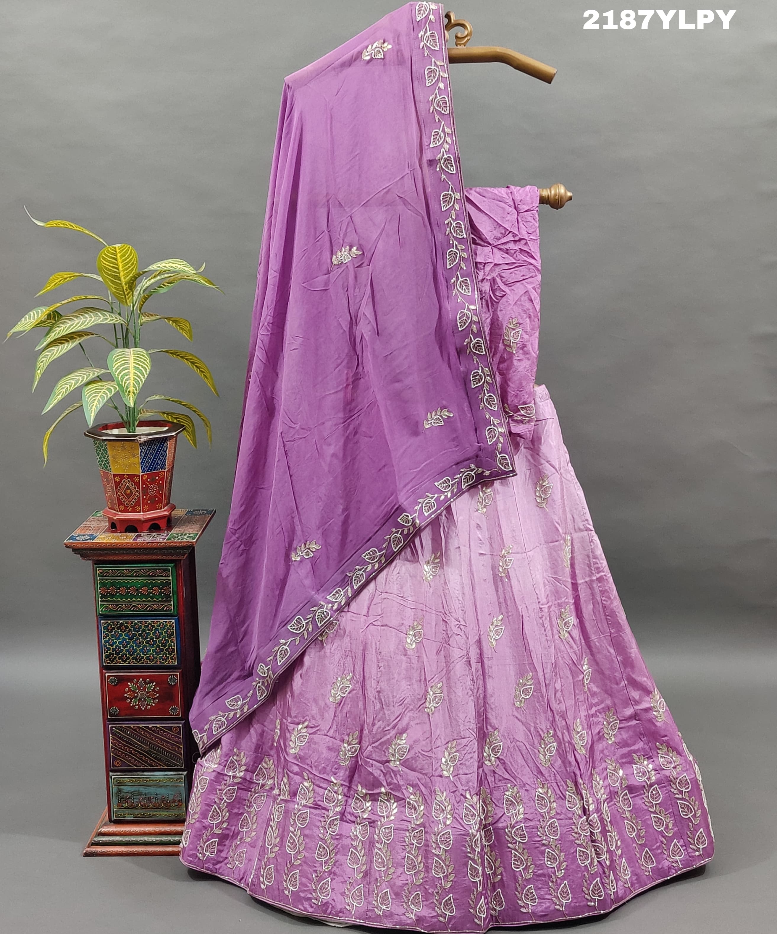 A traditional style Upada silk lehenga in purple with white bead work 