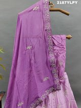 A traditional style Upada silk lehenga in purple with white bead work 