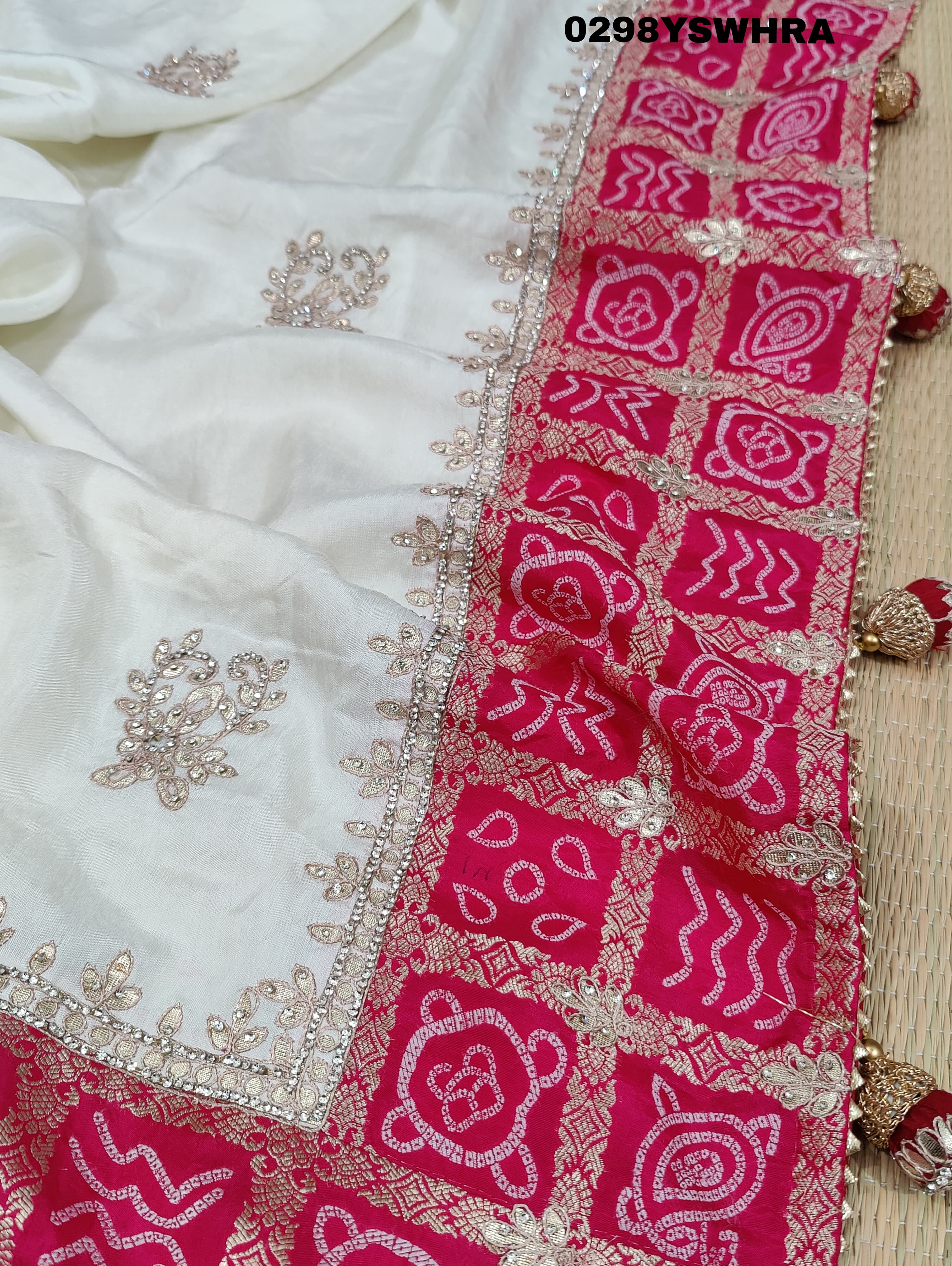 Munga Silk saree with Bandhani style embellishments and Gotapatti work, predominantly pink and white.