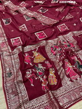 A wine colored Dola Silk saree with Banarasi style stone work, depicting traditional Indian motifs and characters.