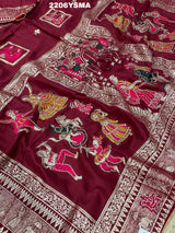 A wine colored Dola Silk saree with Banarasi style stone work, depicting traditional Indian motifs and characters.