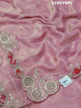 A pink Chinon silk saree with white and silver cutdana bead work and traditional border design.