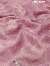 A pink Chinon silk saree with white and silver cutdana bead work and traditional border design.