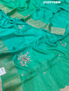 A green saree with floral zardozi work and Banarasi style 