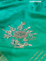A green saree with floral zardozi work and Banarasi style 