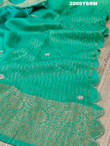 A green saree with floral zardozi work and Banarasi style 