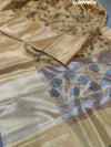 A yellow and blue floral patterned Tussar silk saree with Banarasi weaving.