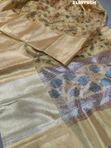 A yellow and blue floral patterned Tussar silk saree with Banarasi weaving.
