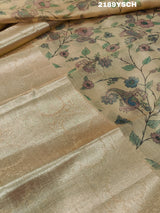 A yellow and blue floral patterned Tussar silk saree with Banarasi weaving.