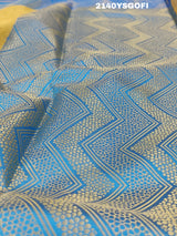 A tissue silk banarasi saree with zari weaving, featuring a blue and gold design on a beige fabric, meant for party or casual wear.