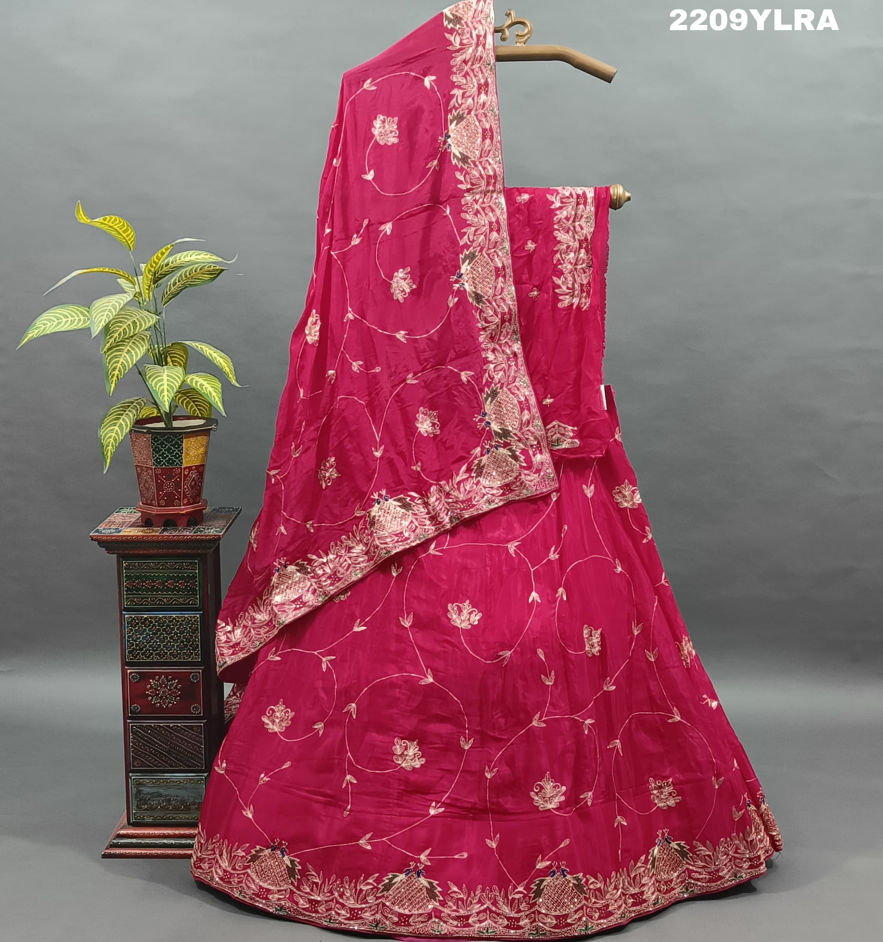 A traditional style pink Chinon silk lehenga with mukesh work