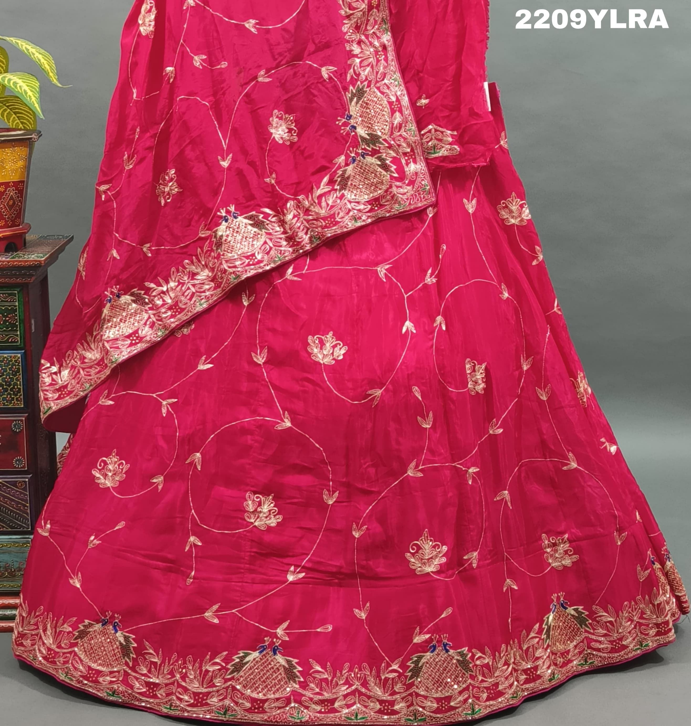 A traditional style pink Chinon silk lehenga with mukesh work