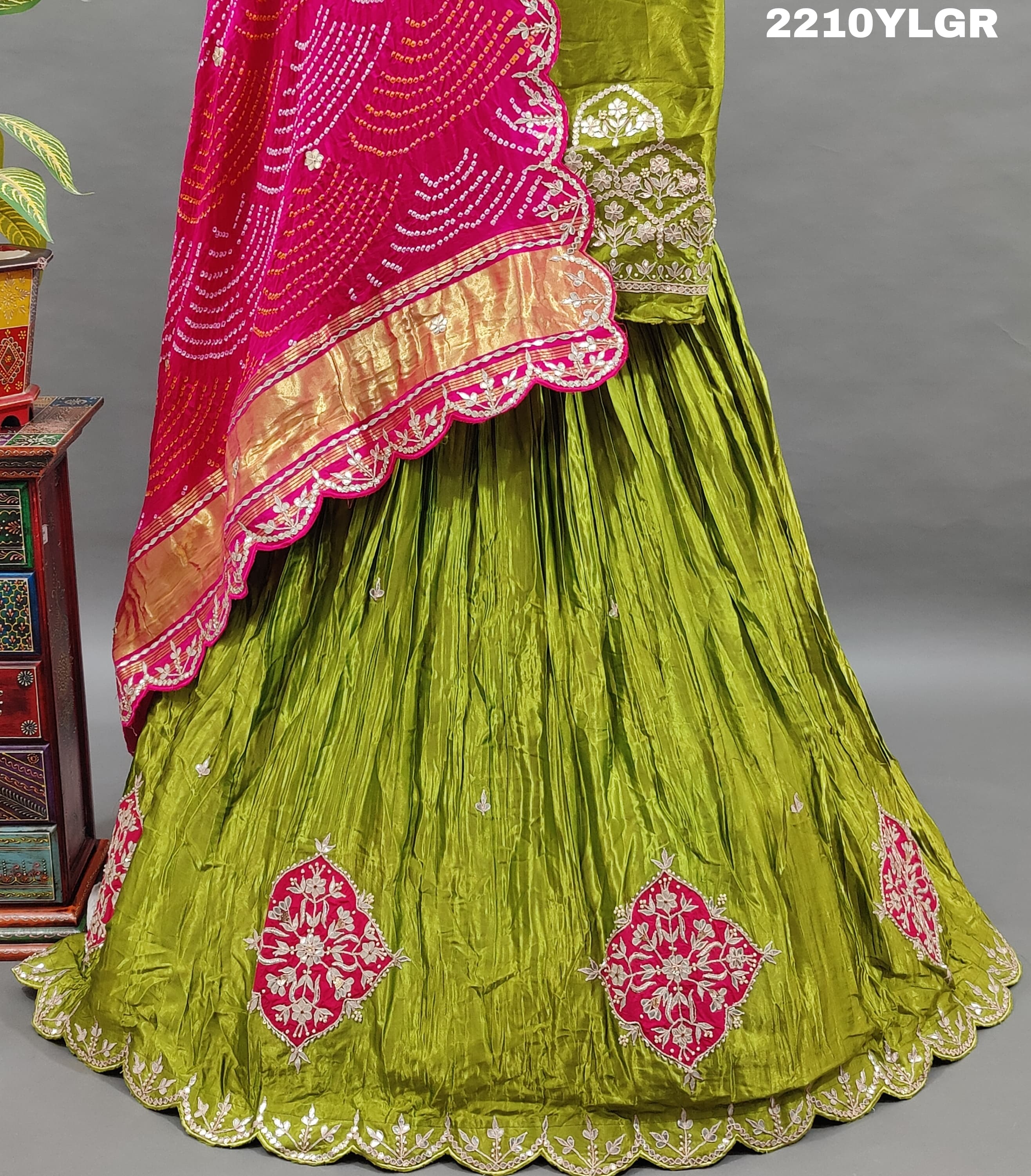 A traditional style lehenga with Bandhani style print and Gota Patti work, featuring green color