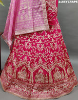 A traditional Indian lehenga choli in pink and white Banarasi silk handwork 