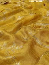 A yellow and red traditional saree with sequence embroidery work and a Banarasi style border.