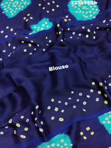 A blue and green bandhani style saree with a floral pattern