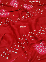 A red and white bandhani style saree 