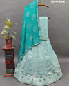 A traditional Indian lehenga with cutdana and gotapatti work
