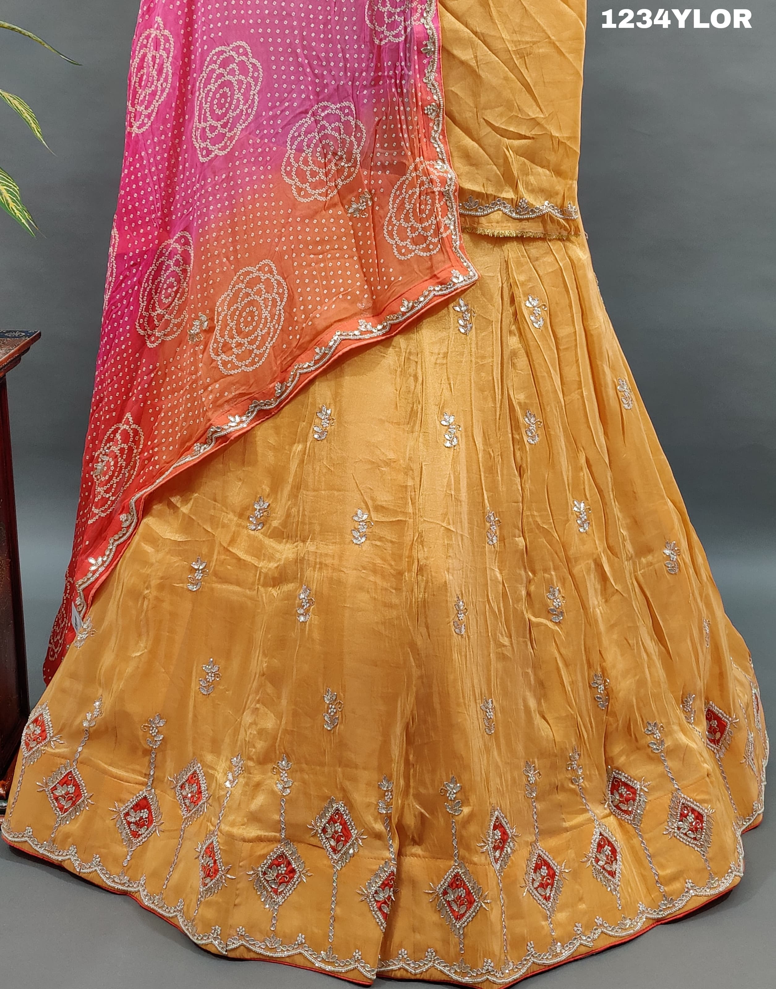 Traditional Indian lehenga choli with cutdana and gotapatti work