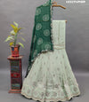 A traditional Indian lehenga set with mirror and gotapatti work
