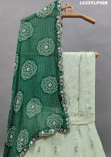 A traditional Indian lehenga set with mirror and gotapatti work