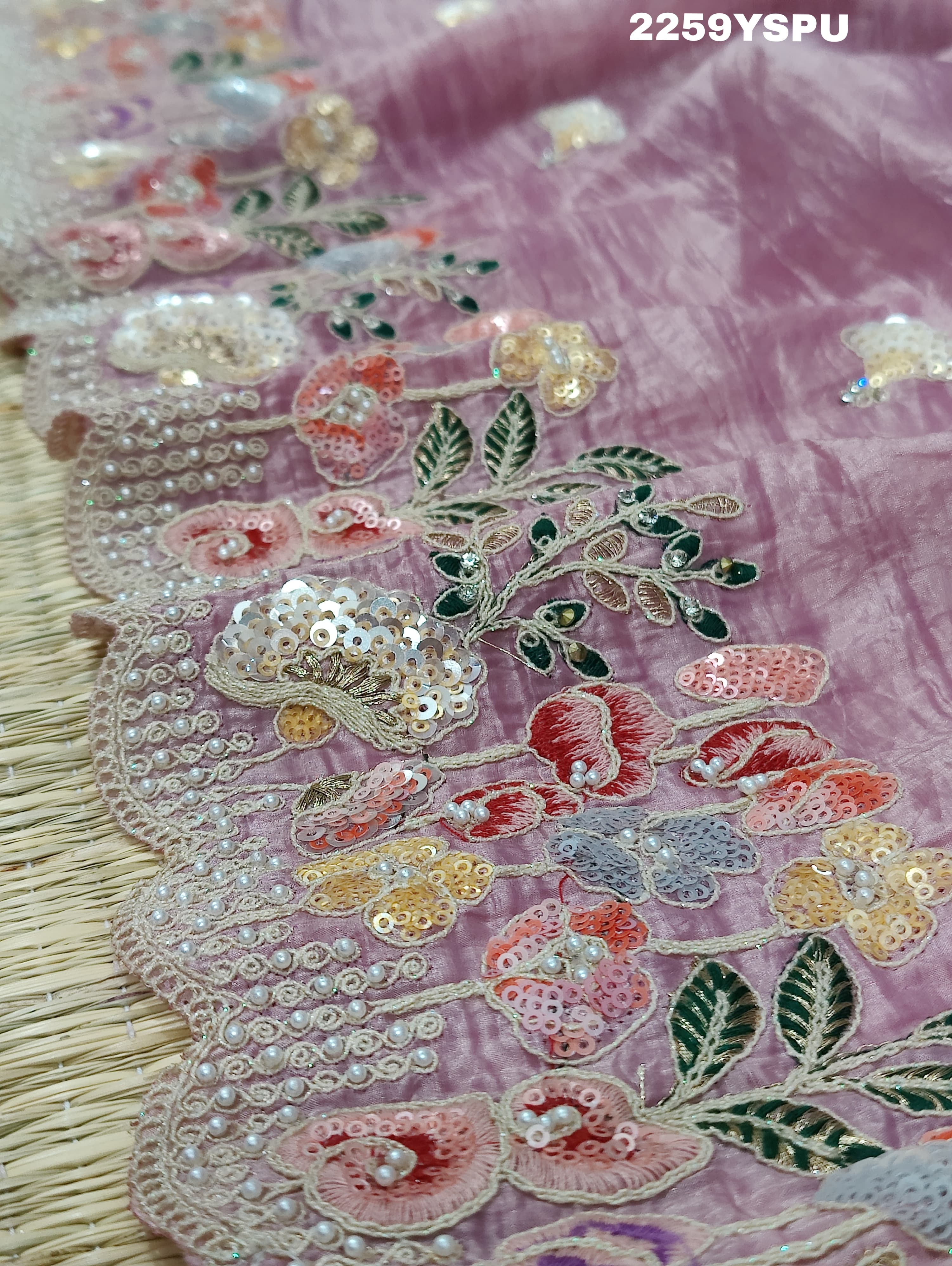 A purple tissue silk saree with Bollywood-style sequence embroidery work, suitable for traditional and party wear.