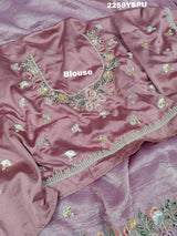 A purple tissue silk saree with Bollywood-style sequence embroidery work, suitable for traditional and party wear.