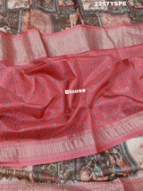 A saree with a kalamkari style pattern in pink colors, with zari weaving and a Banarasi border.
