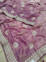 A purple Banarasi silk saree with Bollywood-style embellishments including sequins and gotapatti work, 