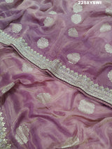 A purple Banarasi silk saree with Bollywood-style embellishments including sequins and gotapatti work, 