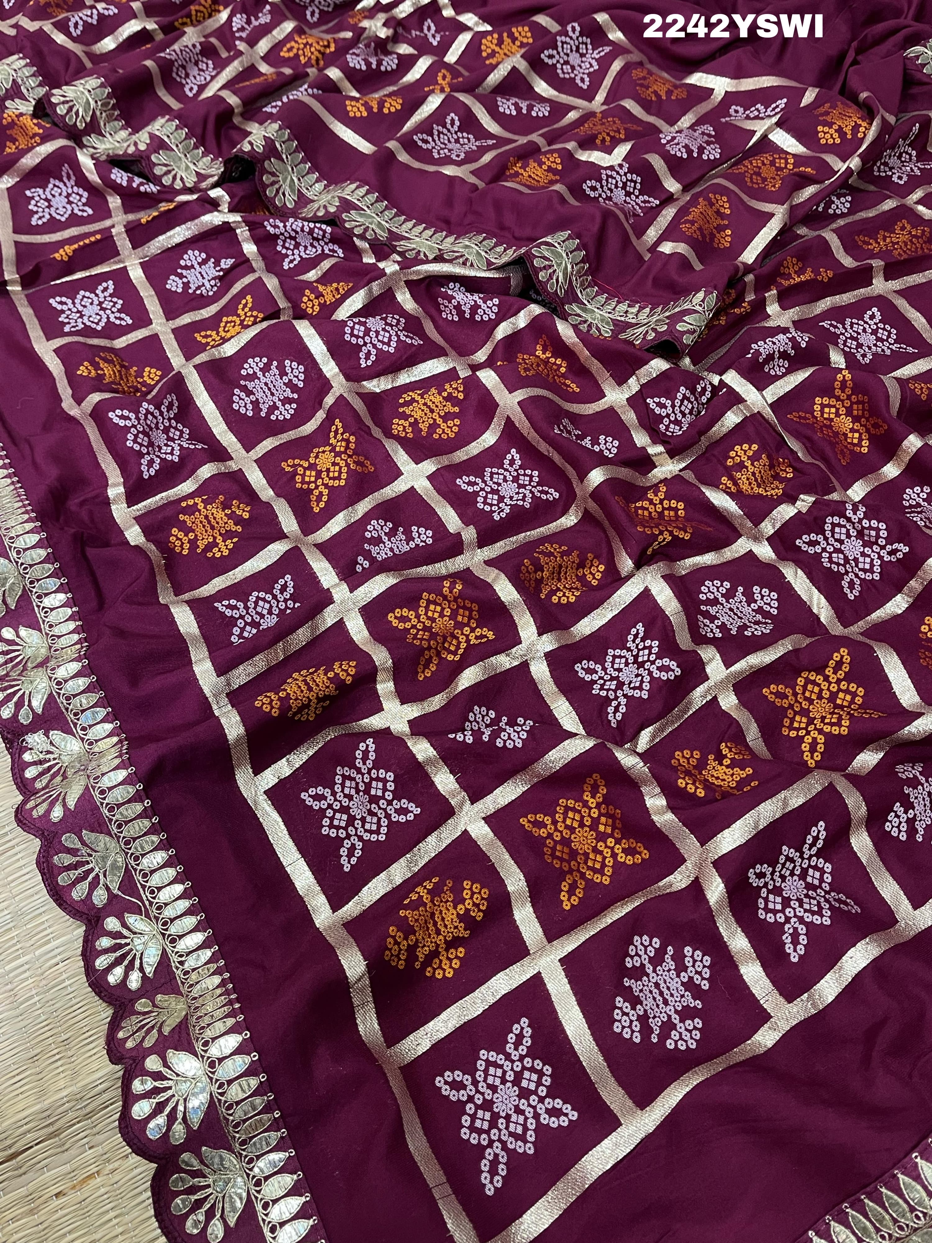A wine saree with white patterns withCotton silk Bandhani Gotapatti Work Saree