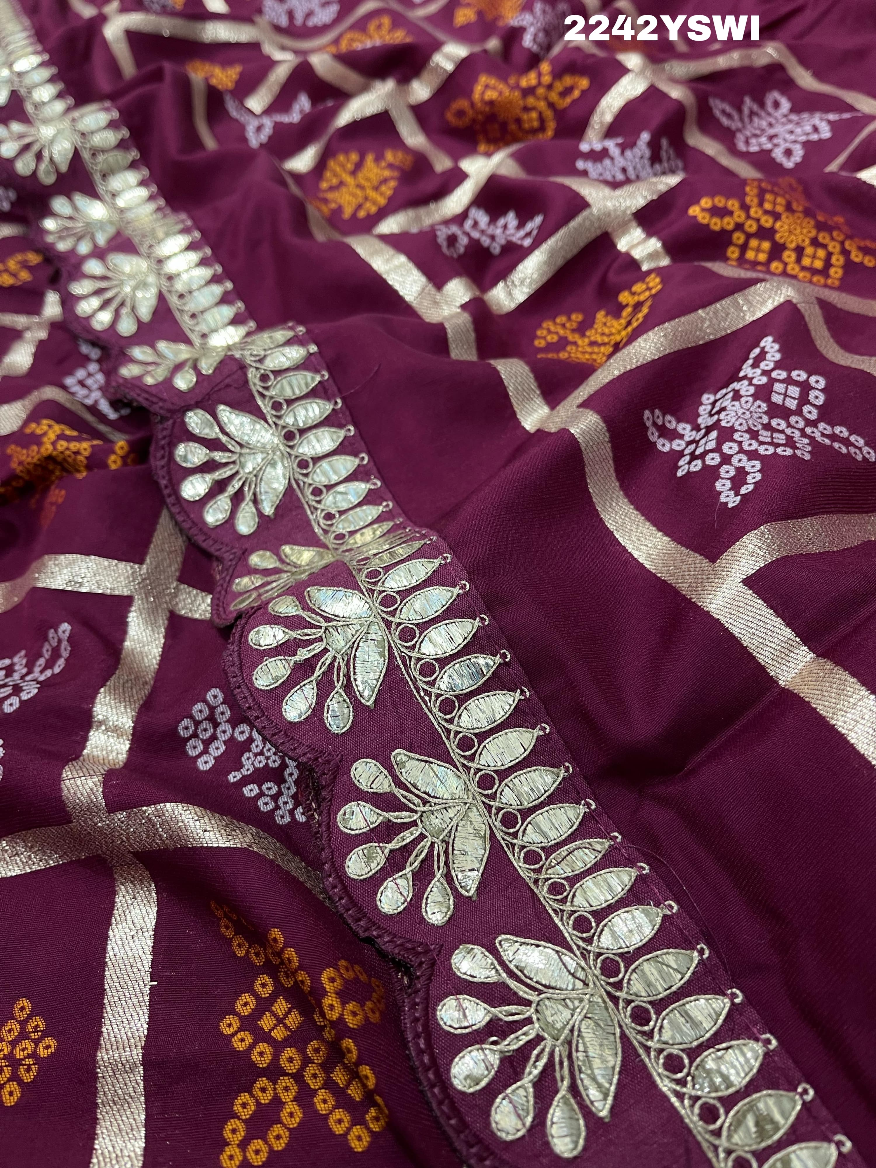 A wine saree with white patterns withCotton silk Bandhani Gotapatti Work Saree