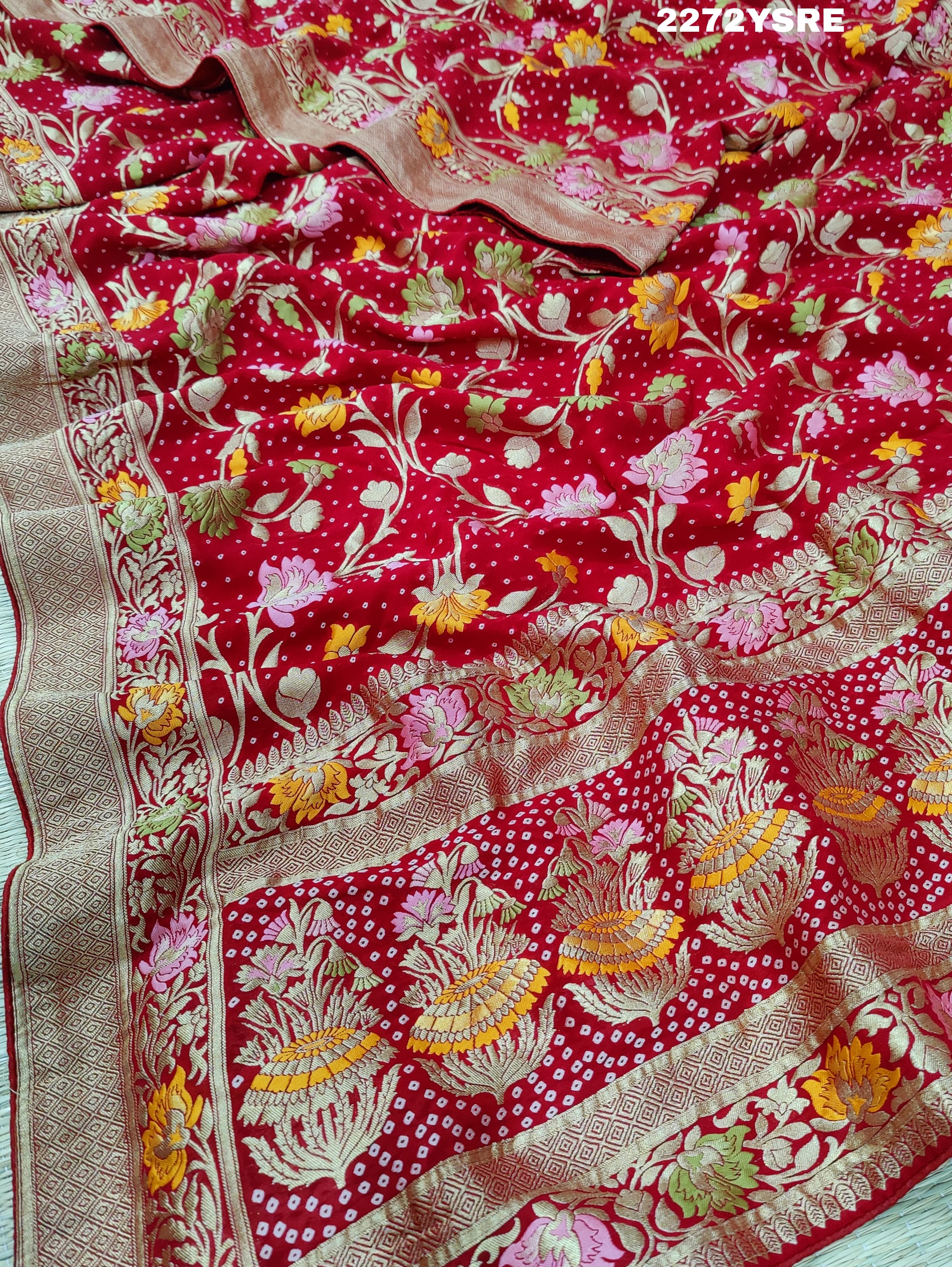 A red and gold Georgette saree with Meenakari weaving pattern 