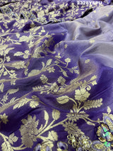 A purple Banarasi style saree with sequence embroidery work 