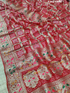 A red and gold georgette bandhani style saree with meenakari weaving, 