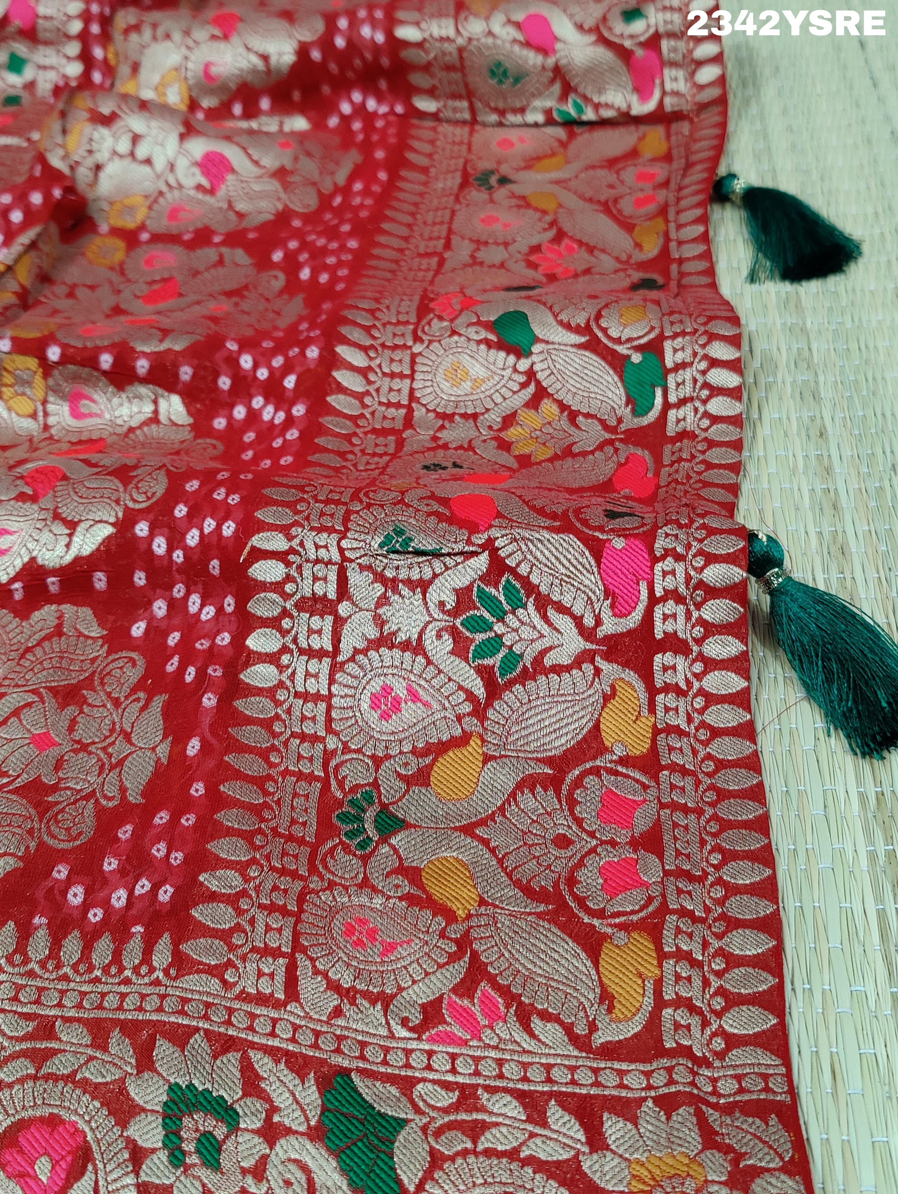 A red and gold georgette bandhani style saree with meenakari weaving, 