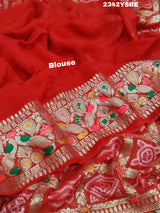 A red and gold georgette bandhani style saree with meenakari weaving, 