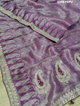 A purple Banarsi silk Bollywood style saree with sequence and gotapatti work, showing detailed patterns and embroidery.