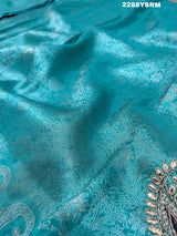A sea green Banarsi silk Bollywood style saree with sequence and gotapatti work