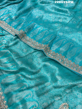 A sea green Banarsi silk Bollywood style saree with sequence and gotapatti work