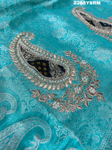 A sea green Banarsi silk Bollywood style saree with sequence and gotapatti work
