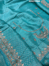 A sea green Banarsi silk Bollywood style saree with sequence and gotapatti work