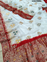 A Banarasi style saree with zari weaving, showcasing both the intricate detailing and the fabric's texture.
