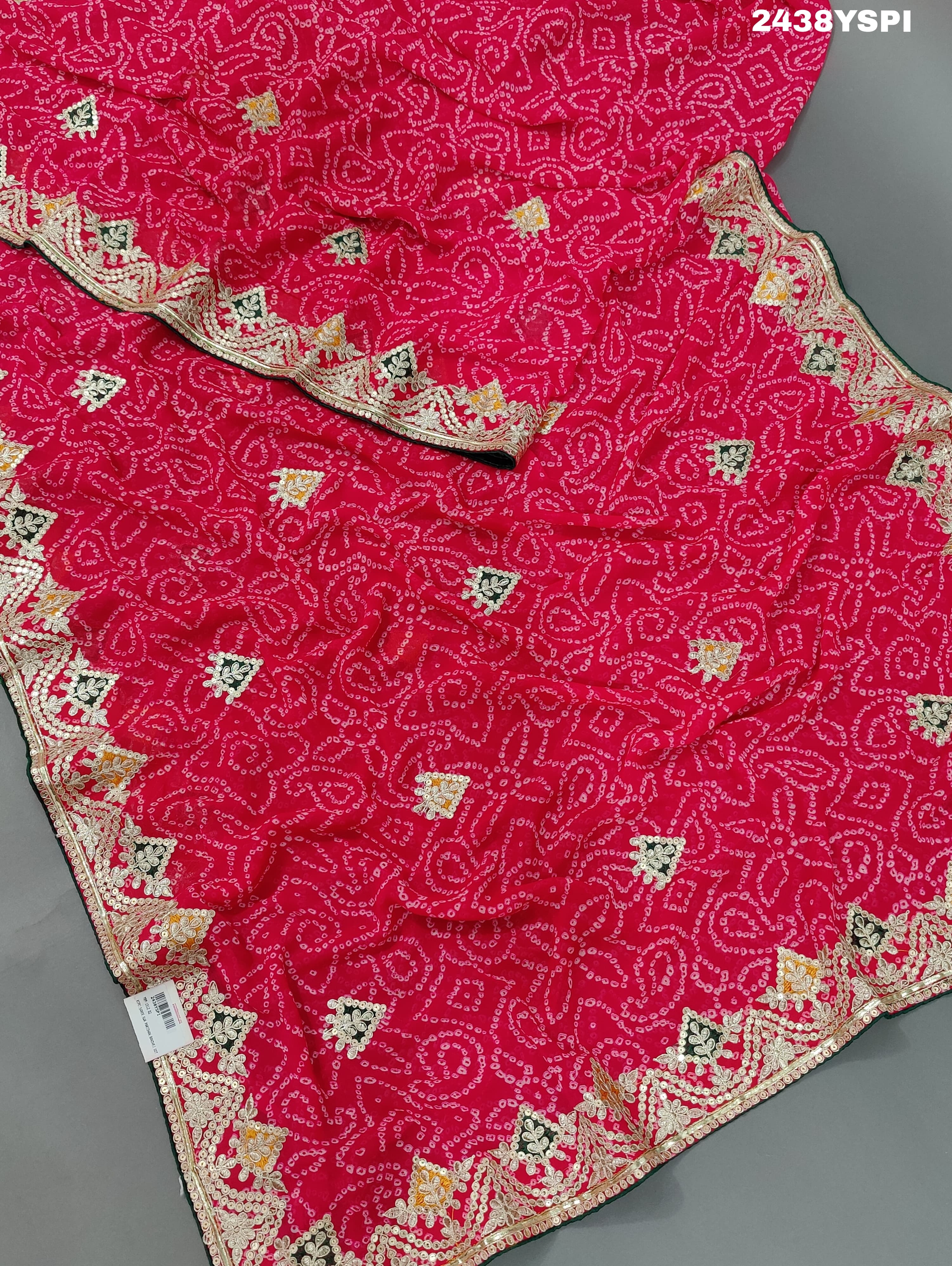 A pink chiffon saree with bandhani pattern and gotapatti work