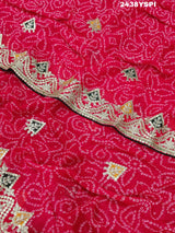 A pink chiffon saree with bandhani pattern and gotapatti work