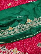A pink chiffon saree with bandhani pattern and gotapatti work